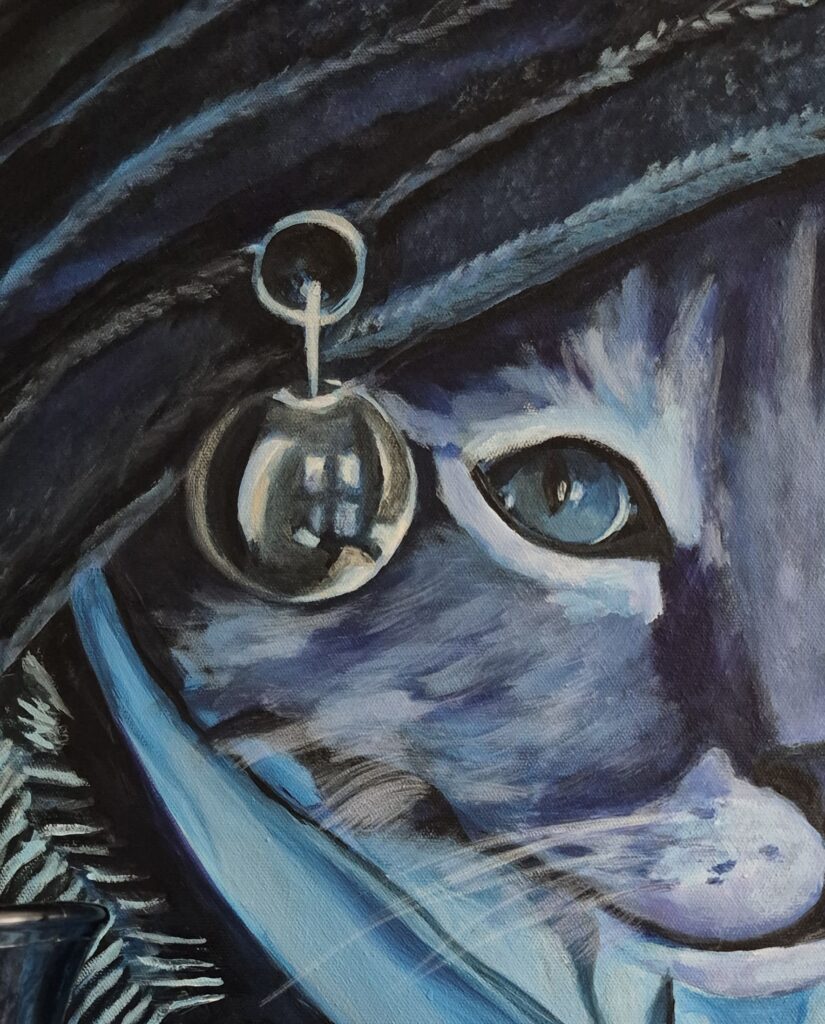 La chatte à la broche argentée